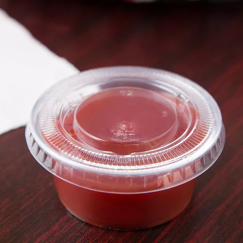 Hyplast - 2 oz. Clear Plastic Soufflé / Portion Cup Lid - Case of 2500